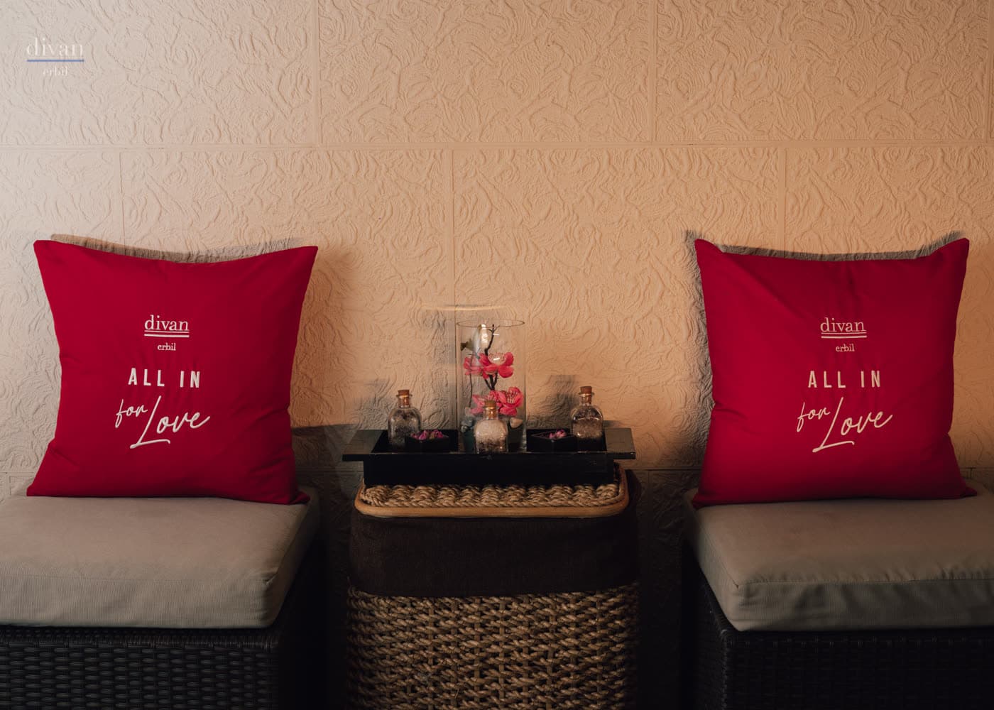 Hospitality atmosphere at Divan Erbil captured with ambient light.