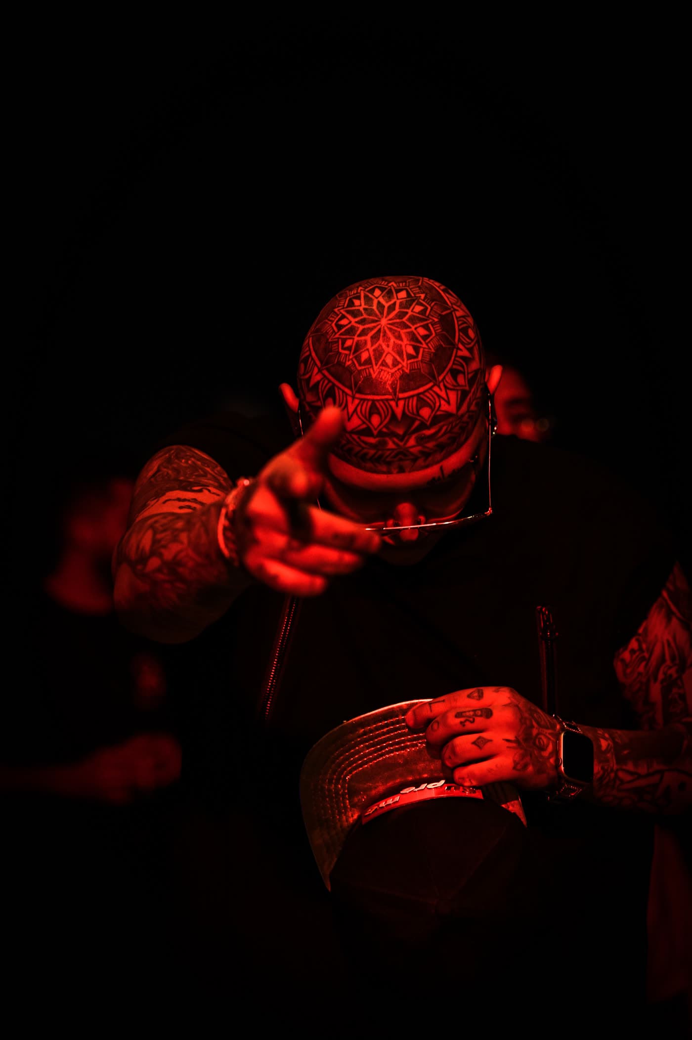 Close portrait from the Marked Portraits series, focused on tattooed skin and expression.